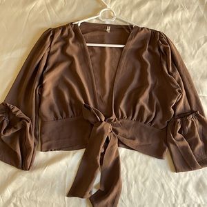 Waist tie detail and long sleeves blouse.